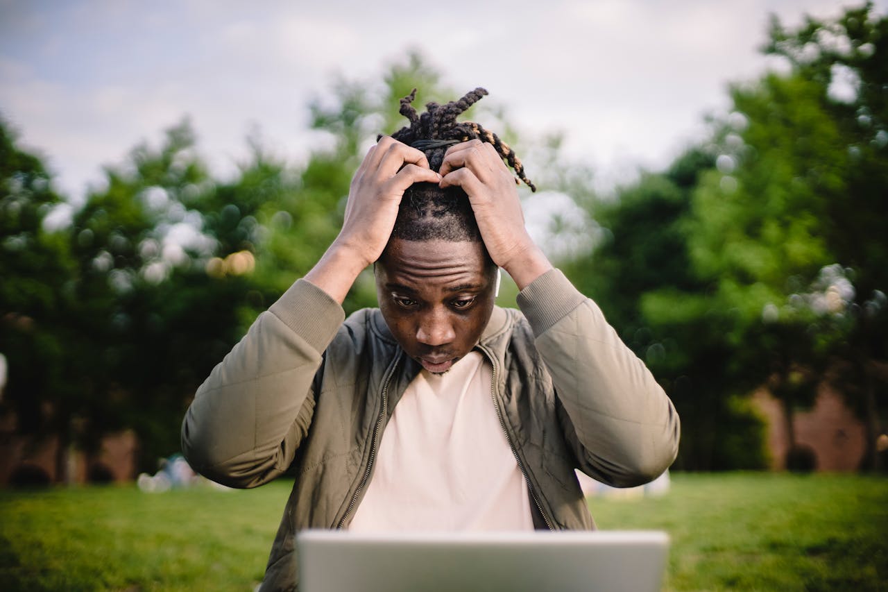 A Black man shocked while looking at his computer screen (Photo credit: Ketut Subiyanto via Pexels)